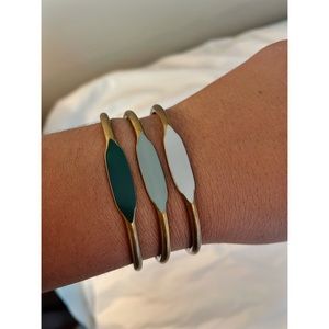 Set of three brass and enamel cuffs